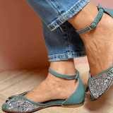 FLAT SANDAL WITH LUMINOUS DETAILS